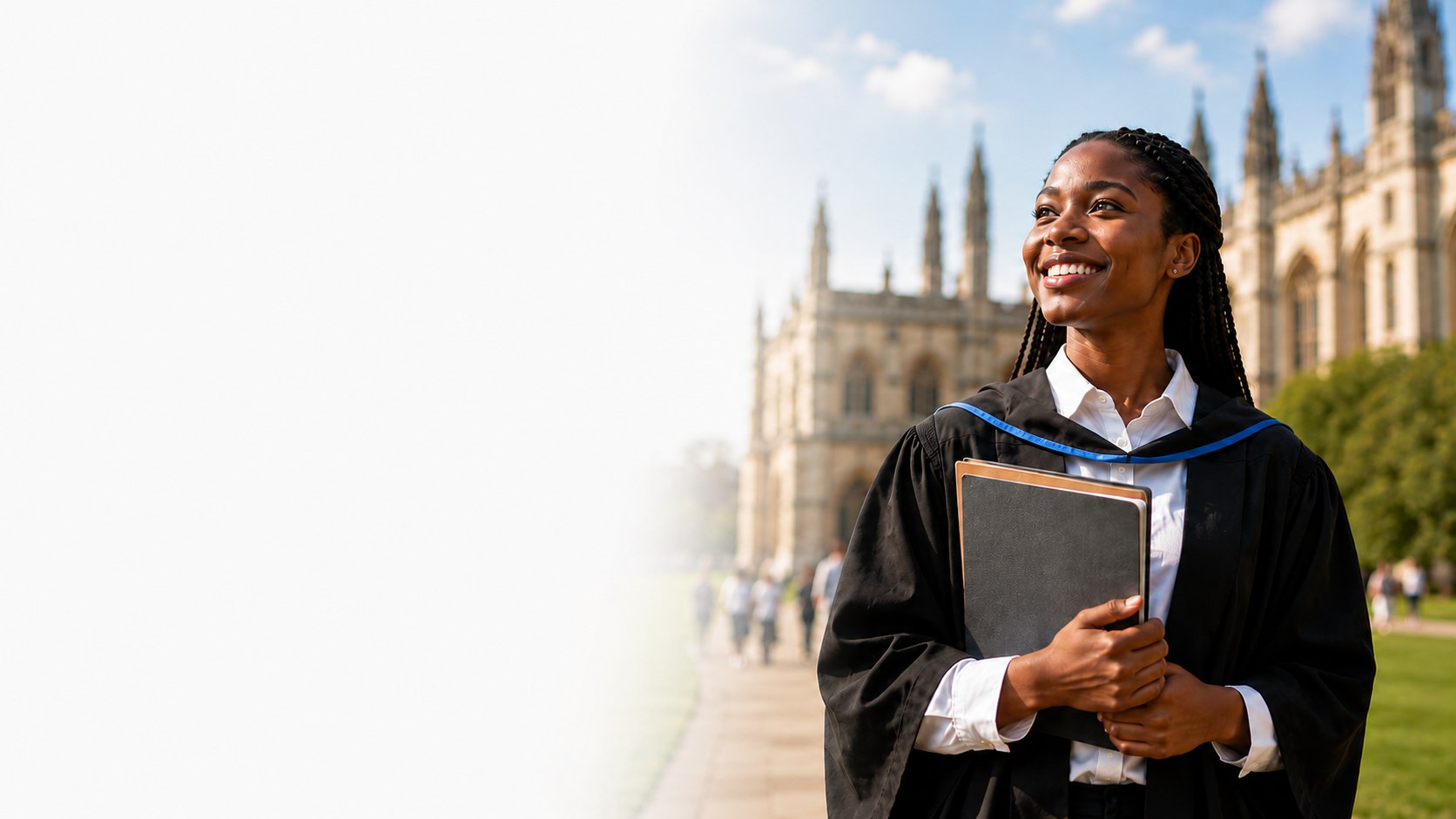 Graduate in gown standing on a university campus